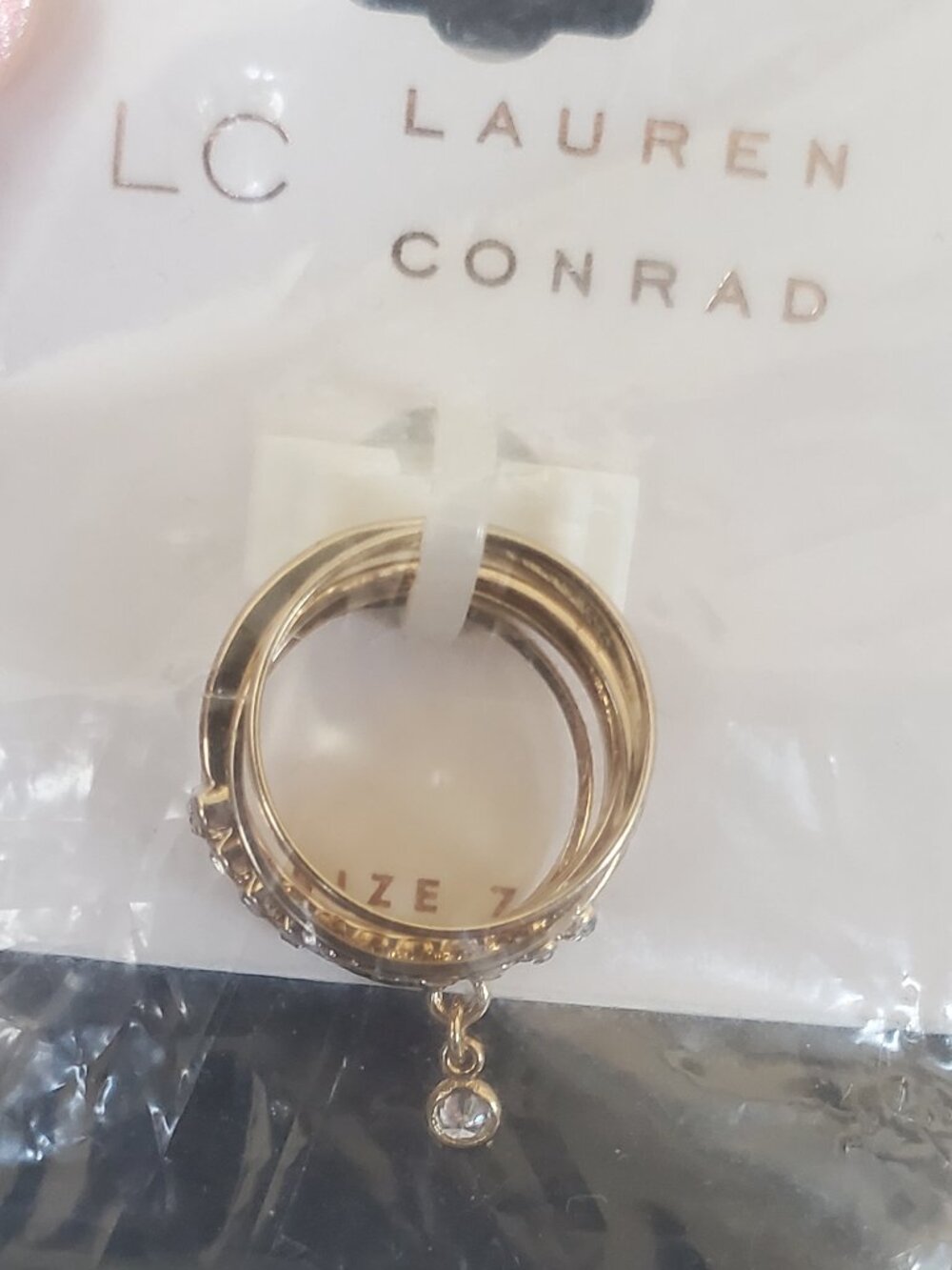 Brand New! Lauren Conrad 5 gold tone rings w/ a charm ring! Size 7 Great gift!